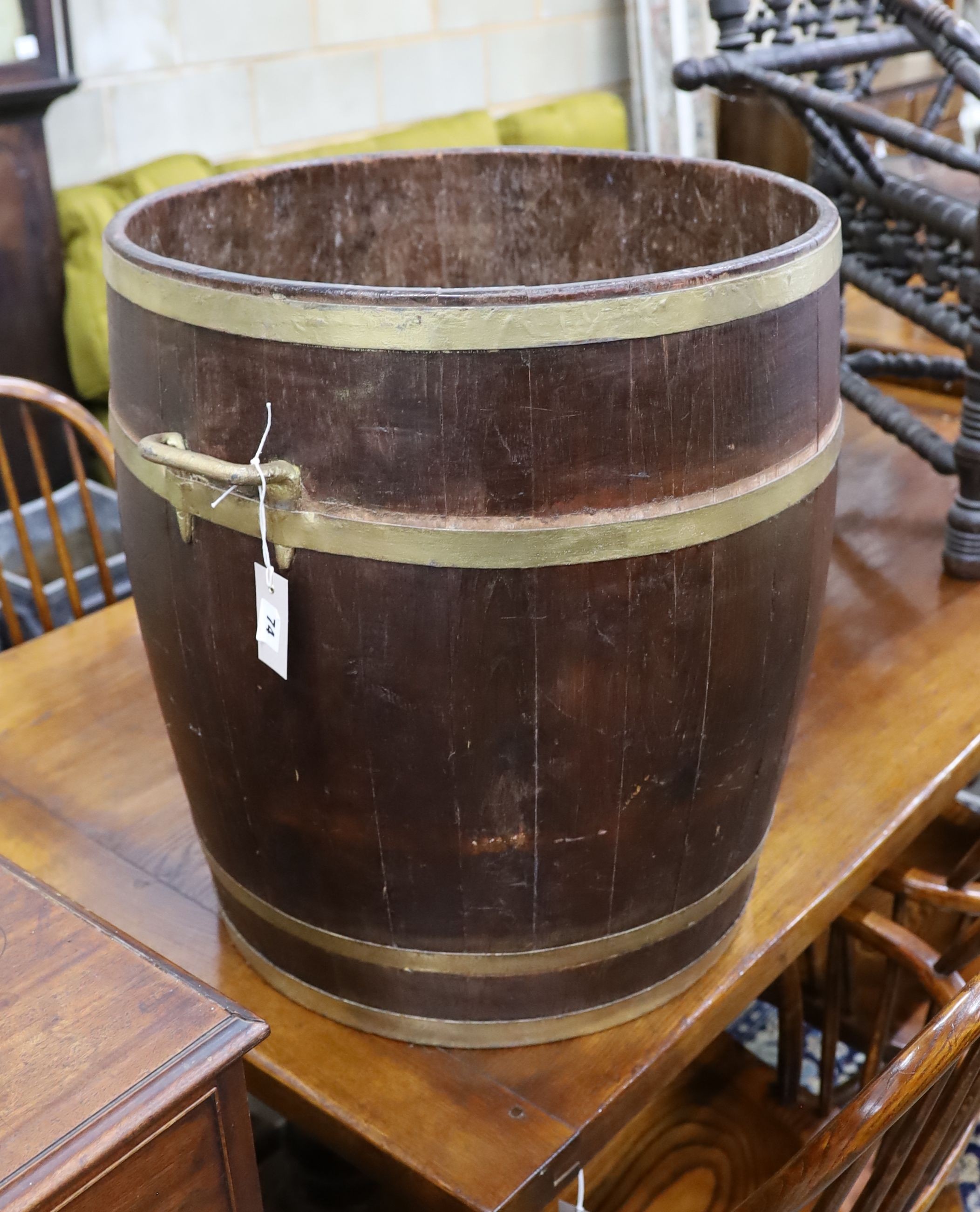 A large brass bound staved oak tub, diameter 54cm, height 61cm